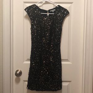 Black with gold sequins.